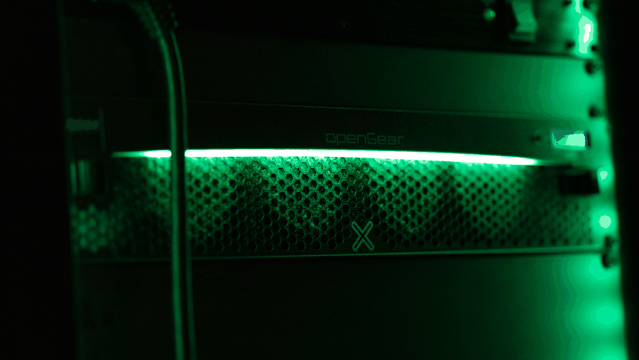 Digital archiving technician handling film reels, metadata tagging interface, secure storage facility